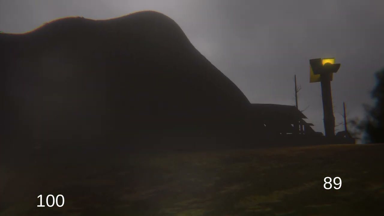 A hill and a lamp post under a grey sky
